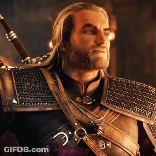 A Man With A Beard And Chain Mail Armor Holds A Sword GIF