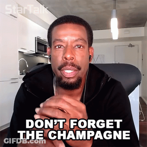 A Man With A Beard And Ear Buds Says " Do N't Forget The Champagne " GIF