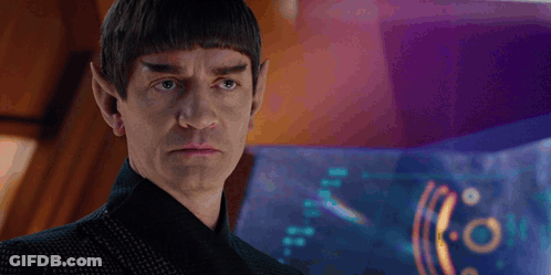A Man With A Beard And Ears Is Looking At Something GIF