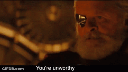 A Man With A Beard And Eye Patch Says " You 'Re Unworthy " At The Bottom GIF