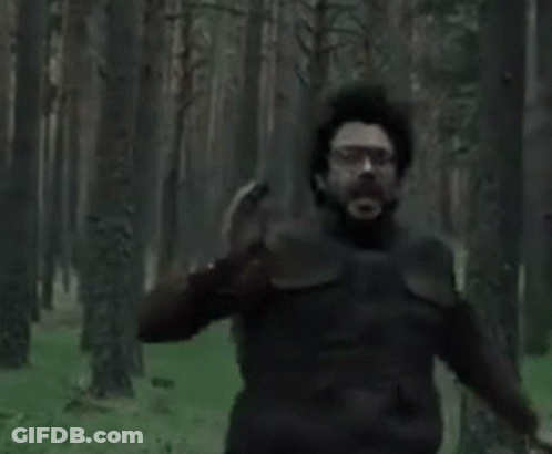 A Man With A Beard And Glasses Is Crying With His Mouth Wide Open . GIF