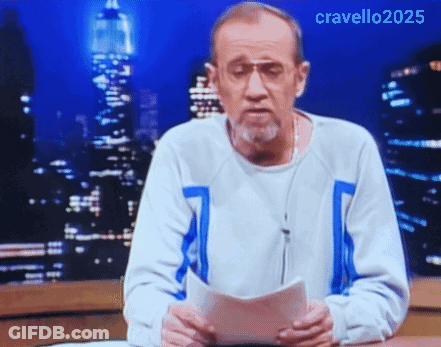 A Man With A Beard And Glasses Is Holding A Piece Of Paper In Front Of A City Skyline .. GIF