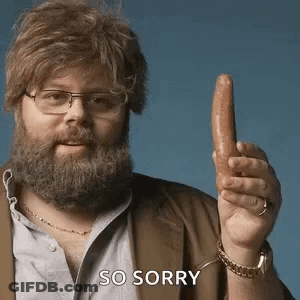 A Man With A Beard And Glasses Is Holding A Sausage In His Hand And Says So Sorry . GIF