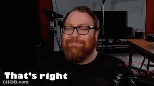 A Man With A Beard And Glasses Is Smiling And Saying That 'S Right GIF
