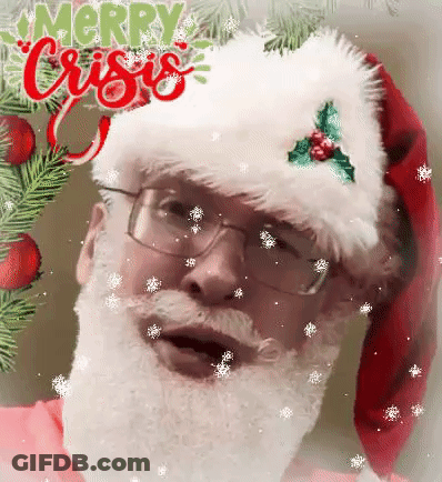 A Man With A Beard And Glasses Is Wearing A Santa Hat And A Christmas Wreath . GIF