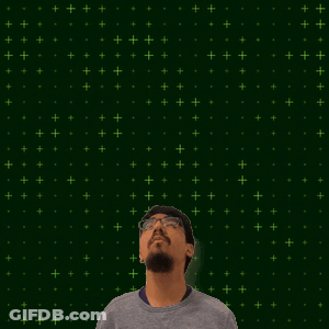 A Man With A Beard And Glasses Looks Up At A Glowing Number 15 GIF