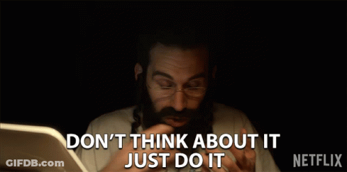 A Man With A Beard And Glasses Says " Don 'T Think About It Just Do It " In Front Of A Laptop GIF