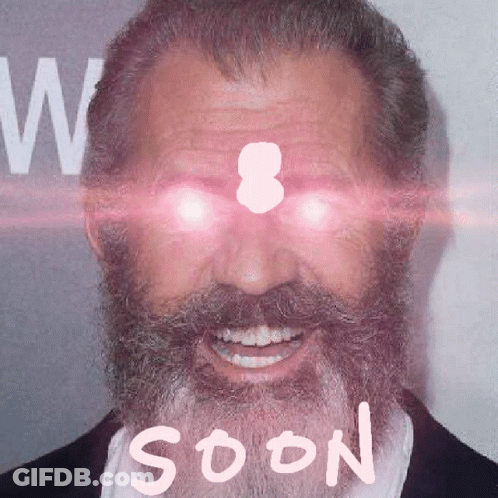 A Man With A Beard And Glowing Eyes Has The Word Soon Written On His Face GIF