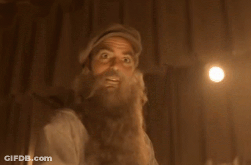 A Man With A Beard And Hat Is Looking Up GIF