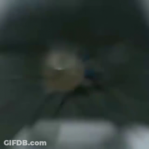 A Man With A Beard And Headphones Is Playing A Video Game .. GIF