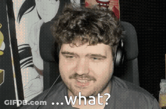 A Man With A Beard And Headphones Is Smiling And Asking What GIF