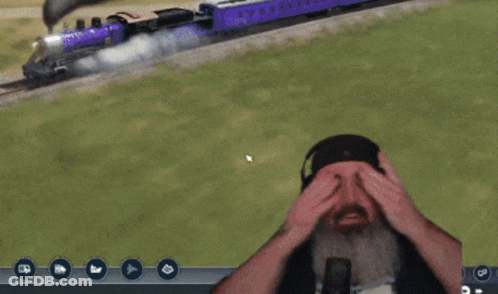 A Man With A Beard And Headphones Says " Hey " In Front Of A Train GIF