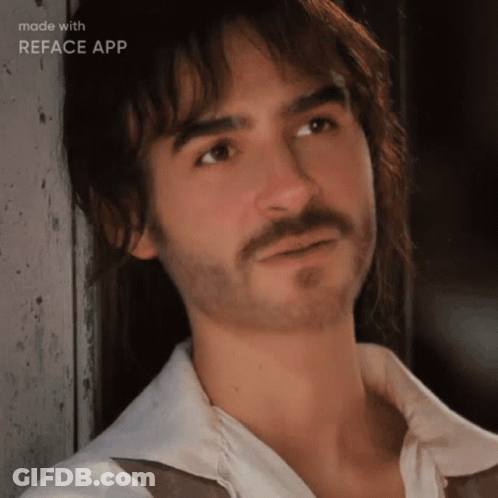 A Man With A Beard And Long Hair Is Being Made With Reface App GIF