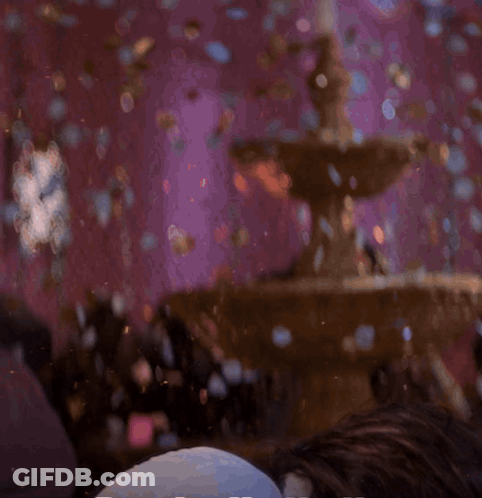 A Man With A Beard And Long Hair Is Laying On His Back GIF