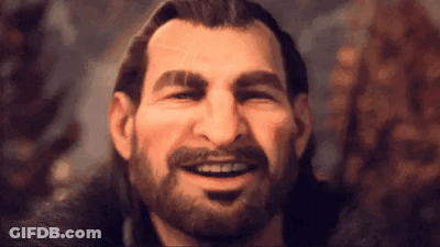 A Man With A Beard And Long Hair Is Smiling And Making A Funny Face . GIF