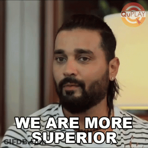 A Man With A Beard And Long Hair Says We Are More Superior GIF
