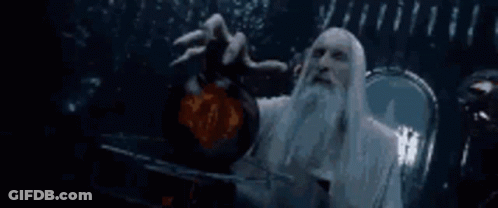 A Man With A Beard And Long White Hair Is Holding A Sphere In His Hand . GIF