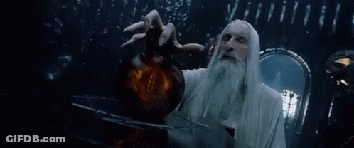 A Man With A Beard And Long White Hair Is Holding A Sphere In His Hand . GIF