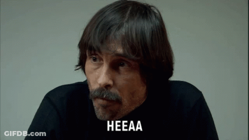 A Man With A Beard And Mustache Has The Word Heeaa On His Face GIF