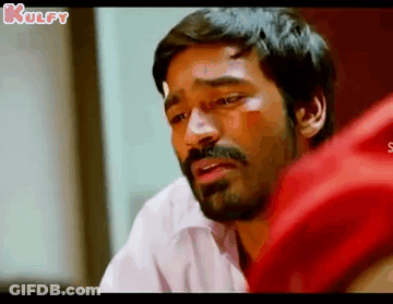 A Man With A Beard And Mustache Is Crying And Looking Down . GIF