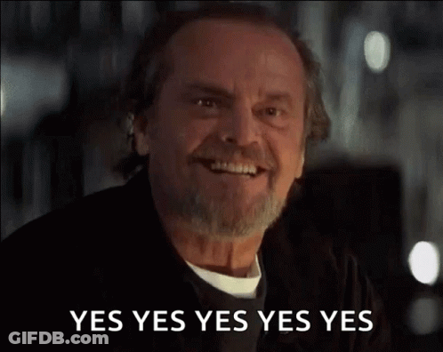A Man With A Beard And Mustache Is Smiling And Saying Yes Yes Yes Yes Yes . GIF