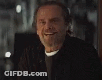 A Man With A Beard And Mustache Is Smiling . GIF