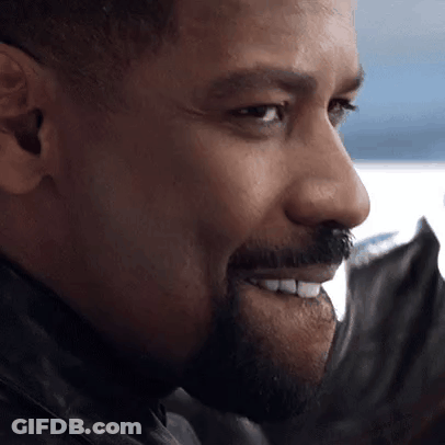 A Man With A Beard And Mustache Is Smiling GIF