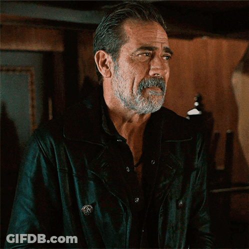 A Man With A Beard And Mustache Is Wearing A Black Jacket GIF