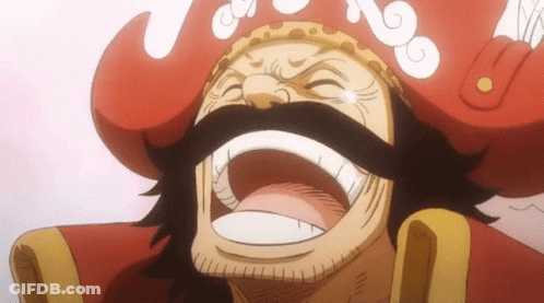 A Man With A Beard And Mustache Is Wearing A Red Hat And Smiling . GIF
