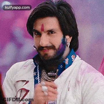 A Man With A Beard And Mustache Is Wearing A White Shirt And Holding A Glass . GIF