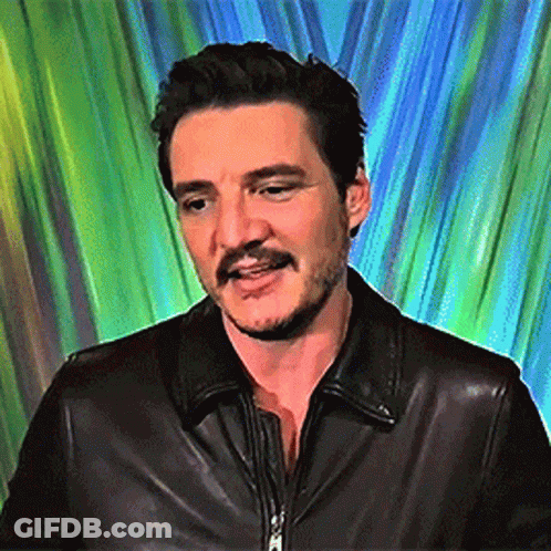 A Man With A Beard And Mustache Wearing A Black Leather Jacket . GIF