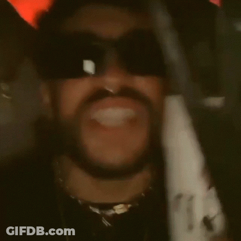 A Man With A Beard And Nose Ring Wears Sunglasses GIF