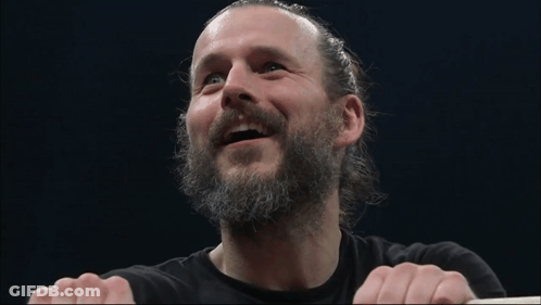 Smiling Man With Beard And Ponytail GIF