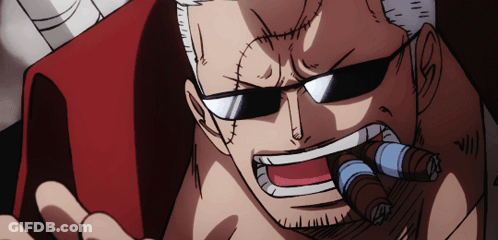 A Man With A Beard And Sunglasses Is Smoking A Cigar GIF
