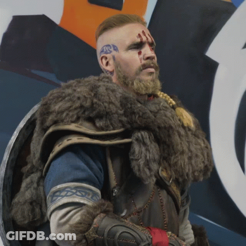 A Man With A Beard And Tattoos On His Face GIF