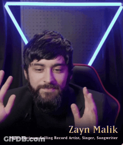 A Man With A Beard And The Name Zayn Malik On The Bottom GIF