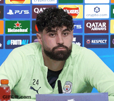 A Man With A Beard And The Number 24 On His Jacket GIF
