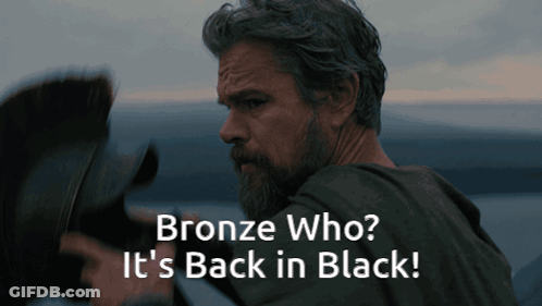 A Man With A Beard And The Words Bronze Who It 'S Back In Black Below Him GIF
