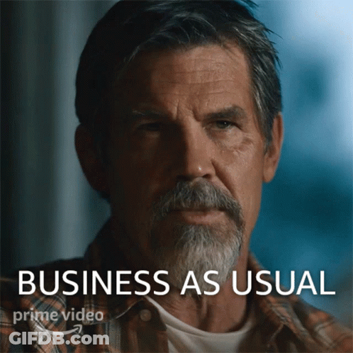 A Man With A Beard And The Words Business As Usual Behind Him GIF