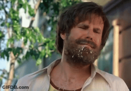 A Man With A Beard Has A Few Drops Of Milk On His Face GIF