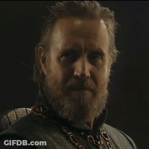 A Man With A Beard Has A Gold Chain Around His Neck GIF