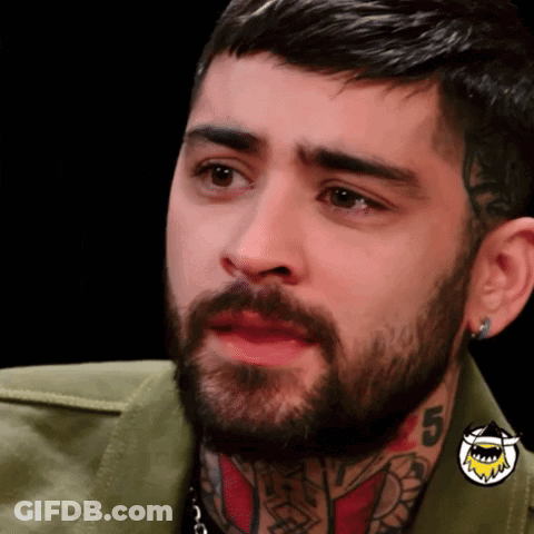 A Man With A Beard Has A Tattoo On His Neck With The Number 5 GIF