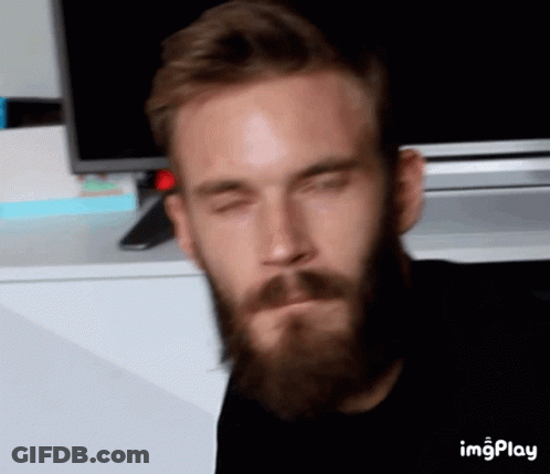 A Man With A Beard Has His Eyes Closed In Front Of A Tv And A Screen That Says Imgplay On It GIF