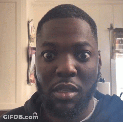 A Man With A Beard Has His Eyes Wide Open GIF