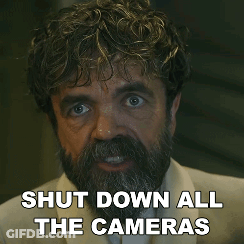 A Man With A Beard Has The Words Shut Down All The Cameras On His Face GIF
