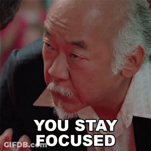 A Man With A Beard Has The Words You Stay Focused On His Face GIF