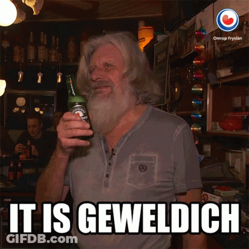 A Man With A Beard Holds A Bottle Of Beer And Says It Is Geweldigch GIF
