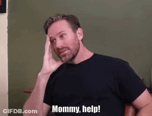 A Man With A Beard Holds His Hand To His Head And Says Mommy Help GIF