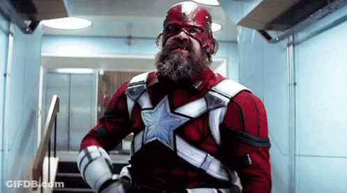 Bearded Man In Red And White Superhero Costume GIF
