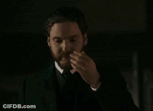 Bearded Man In Suit Smoking Cigarette GIF